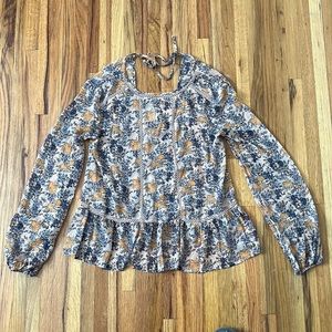 Xhilaration size small polyester top. Blue and orange flower details.